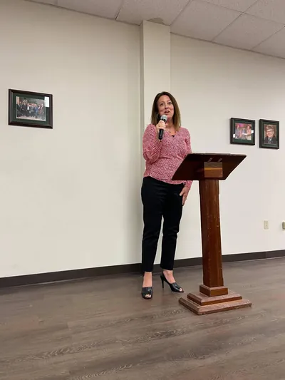 Christine Leeviraphan speaking at a podium